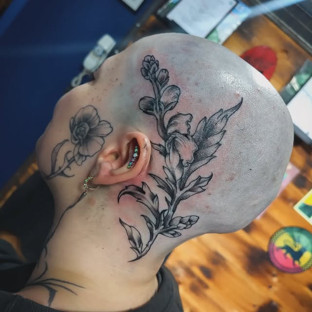 Black and grey illustrative floral tattoo from Ras Tattooist's portfolio